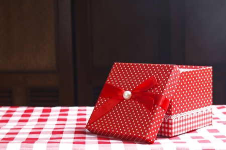 open red gift box on the table for surpriseの写真素材