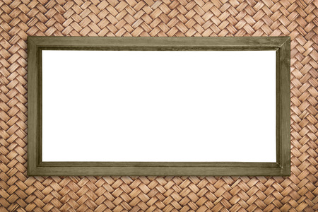 wide picture frame on rattan wall background, isolatedの写真素材