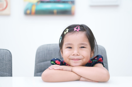 Asian children cute or kid girl and student thinking for new idea and happy fun or smile with stick...