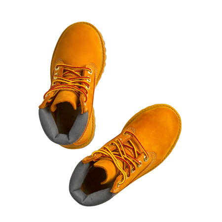 brown or yellow boots shoes for foot and adventure travel or keep walking journey with trekking on...