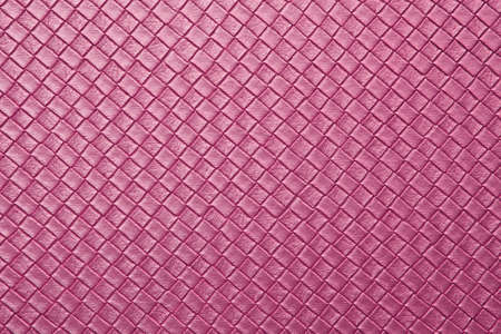 pink leather texture on sofa or sweet color fabric and blank wood wall or top view empty table with grid and diamond or square pattern for love background or valentine day wallpaperの写真素材