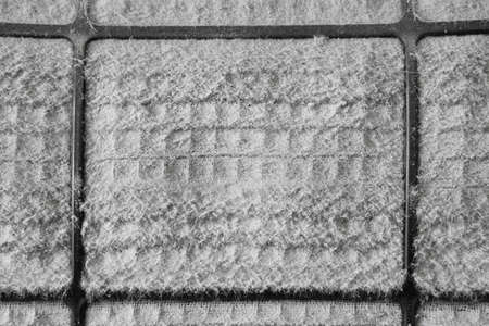 closeup dirty air conditioning filter with PM 2.5 dust and disease bacteria or covid-19 coronavirus to use long time and unclean in bedroom at home which causes allergies and sneeze with cold coughの写真素材