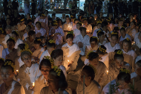 LAMPANG, THAILAND - Oct 13,2017 : Thai people singing the anthem and hold the candles at five clock tower intersection pray for his Majesty King Bhumibol Adulyadej's.のeditorial素材