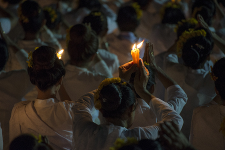 LAMPANG, THAILAND - Oct 13,2017 : Thai people singing the anthem and hold the candles at five clock tower intersection pray for his Majesty King Bhumibol Adulyadej's.のeditorial素材