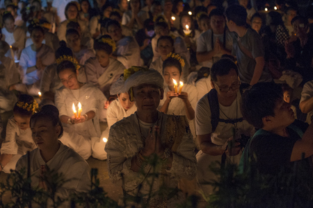 LAMPANG, THAILAND - Oct 13,2017 : Thai people singing the anthem and hold the candles at five clock tower intersection pray for his Majesty King Bhumibol Adulyadej's.のeditorial素材