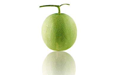 green cantaloupe melon on the white backgroundの写真素材