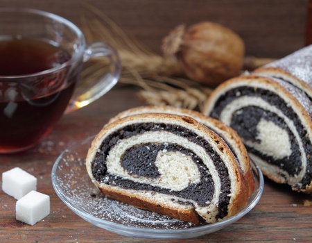 Roll with a poppy and teaの写真素材