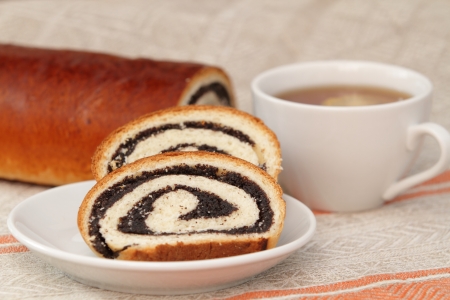 Fresh roll with a poppy の写真素材