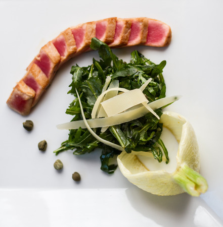 Tuna, root of fennel and green salad, top viewの写真素材