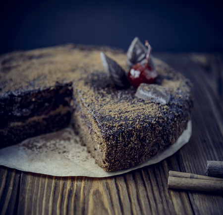 Black chocolate cake on the wooden tableの写真素材