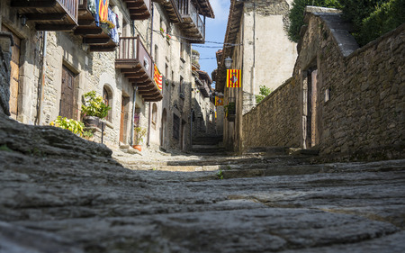 Old stone street in the medieval town of Rupit, Cataloniaの写真素材