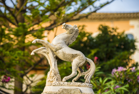 OLIVELLA, SPAIN - Decorative figure of a horse on the fence. Barcelona province, Catalonia, Spainの写真素材
