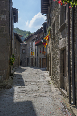 RUPIT I PRUIT, CATALONIA, SPAIN - OCTOBER 04, 2016: Street in medieval catalan village Rupit in the...