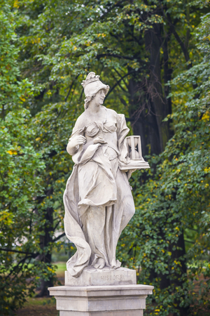 Sandstone statue in the Saxon Garden, Warsaw, Poland. Allegorical depiction of History. Made before 1745 by anonymous Warsaw sculptor under the direction of Johann Georg Plerschの写真素材
