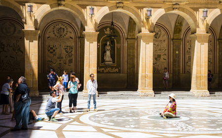 MONTSERRAT, CATALONIA, SPAIN - JULY 05, 2017: Tourists are photographed near the church in the Benedictine abbey of Santa Maria de Montserratのeditorial素材