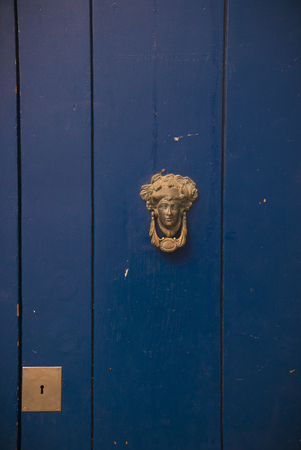 Beautiful blue door with door knocker in Sitges, Spainの写真素材