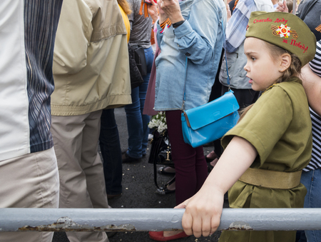 SEVASTOPOL / CRIMEA - MAY 09, 2017: A girl in soldier's uniform at the celebration of the Victory Day in Sevastopolのeditorial素材