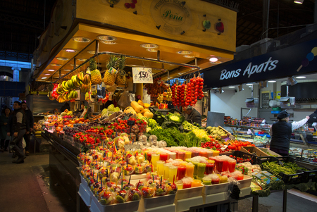 BARCELONA, CATALONIA/SPAIN - 22 JANUARY 2019: Boqueria Market - food marketplace in Barcelona. Sale of fruit in La Boqueria marketのeditorial素材