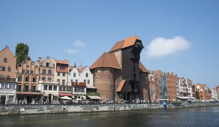 GDA?SK / POLAND - 28 JULY 2018: Panorama of Old Town with Old harbour crane, city gate  and Motlawa...