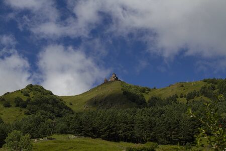 View of Gergeti Trinity Church in the Caucasus mountains. Georgia