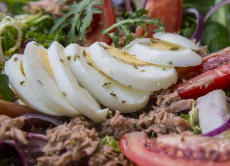 Tuna salad with vegetables and eggs, close upの写真素材