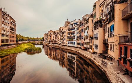 GIRONA, CATALONIA / SPAIN - JUNE 15, 2018: Beautiful colorful houses in Girona city