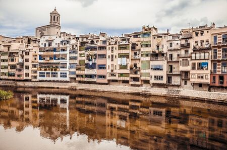 GIRONA, CATALONIA / SPAIN - JUNE 15, 2018: Beautiful colorful houses in Girona city