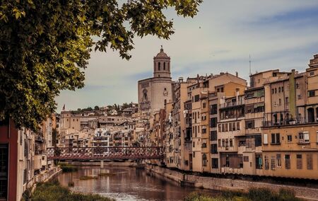 GIRONA, CATALONIA / SPAIN - JUNE 15, 2018: Beautiful colorful houses in Girona city