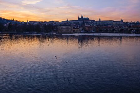 Sunset on the Vltava river. Prague city, Czech Republicの写真素材