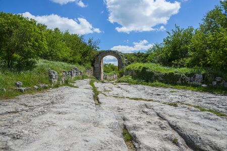 Ancient stony road through Chufut-Kale, medieval cave settlement in Crimea