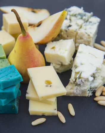 Cheese platter with nuts and pearsの写真素材
