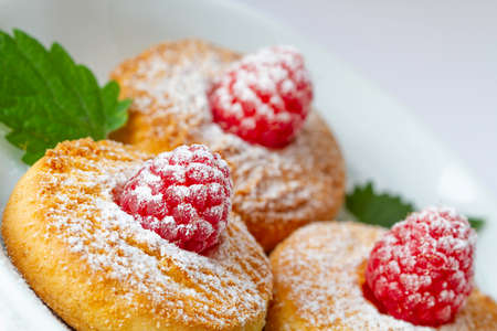 Cookies with a raspberry and powdered sugarの写真素材