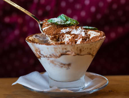 Tiramisu - traditional italian dessert from mascarpone cheese and biscuit in a glassの写真素材