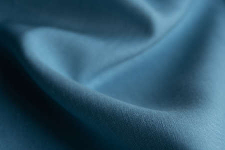 Linen fabric, blue background. Soft linen blue fabric texture. Textured fabric background. Macro with shallow dofの写真素材