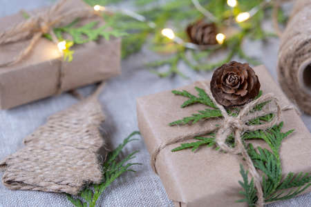 New Year's gifts in craft packaging. Christmas and New Year holidays background