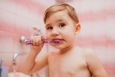 Little child boy brushing his teeth in bathroom. Going to sleep. Dental careの写真素材