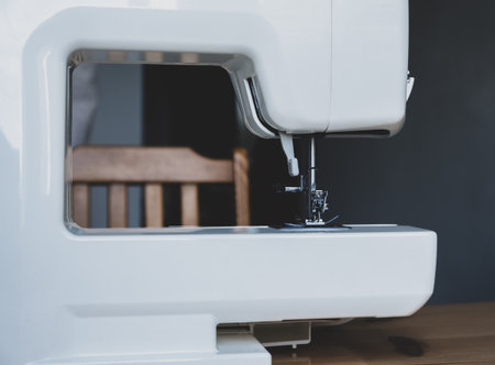 Sewing machine on a table in a sewing workshopの写真素材