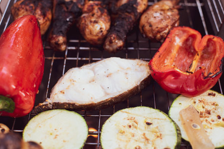 The process of cooking on a barbecue grill. Picnic food, outdoor foodの写真素材