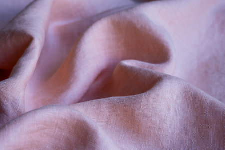 Wrinkled linen cloth folded napkins. Linen fabric texture. Concept of using natural eco-friendly materialsの写真素材