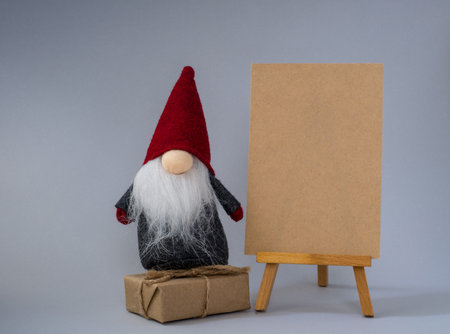 Christmas Gonk sit on the gift. Christmas or New Year concept, greeting card, mock upの写真素材