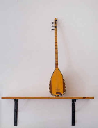 Saz - Traditional Turkish Music Instrument on the wooden shelf, copy space. The concept of Islamの写真素材