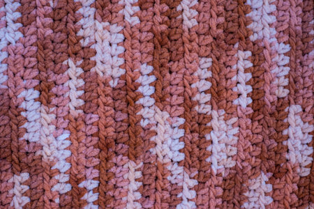 Hand-crocheted plain. Geometric seamless pattern. The texture is crocheted. Crochet. Knitted...