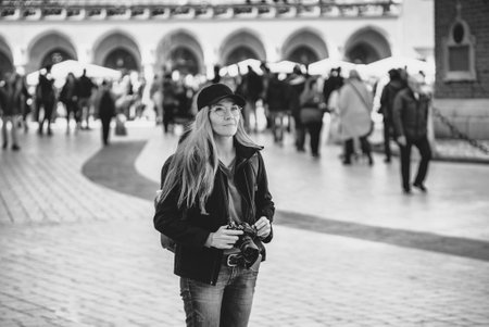 Young beautiful caucasian traveler woman with digital compact camera. Travel lifestyle, world travel explorer, tourism concept. World Photography Dayの写真素材