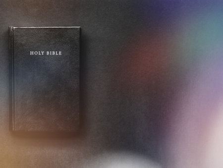 Holy Bible on the black background, vintage. Christian concept, copy spaceの写真素材