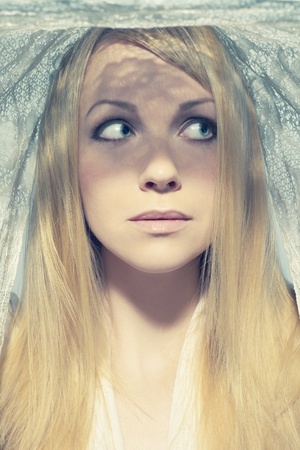 Portrait of beautiful young woman under a veilの写真素材