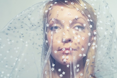 Portrait of beautiful young woman under a veilの写真素材