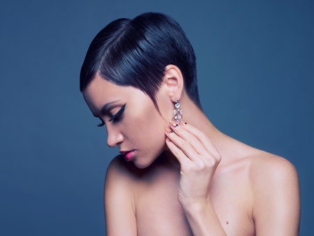 Sensual portrait of a beautiful lady with diamond earring