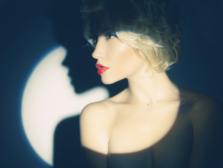 Beautiful lady in the spotlight. の写真素材