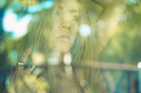Art portrait of beautiful blonde through the glassの写真素材