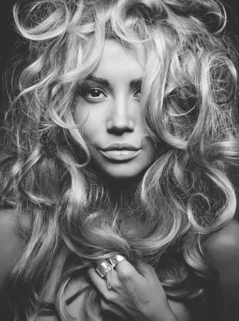 Black and white portrait of eautiful woman with magnificent blond hair. Hair extension, permedの写真素材